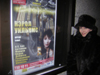 Carol Williams beside
                        her Moscow performance Poster